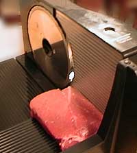 A slicing machine used for slicing different meats