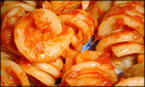 Image of pasta served with aromatic sauce